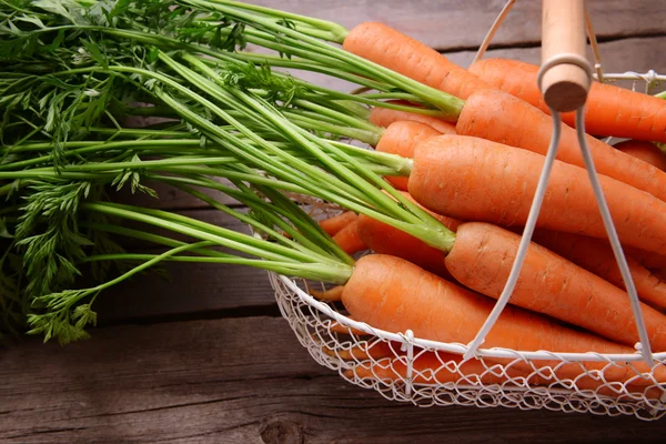 Fresh carrots in basket — Stock Photo, Image