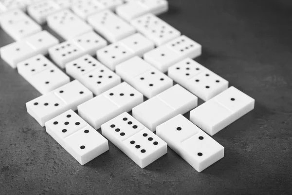 Heap of dominoes on grey — Stock Photo, Image