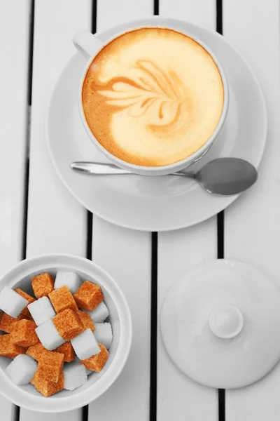 Cappuccino and refined sugar — Stock Photo, Image