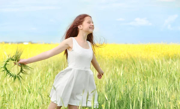 Sweet girl in spring meadow — Stock Photo, Image