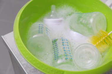 Sterilizing baby bottles  clipart