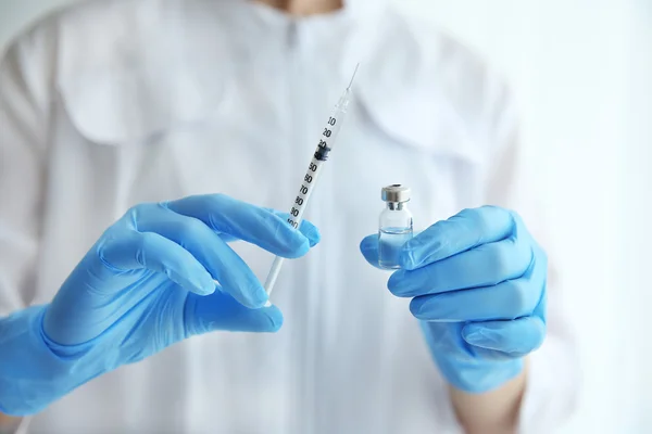 Doctor hands with syringe — Stock Photo, Image