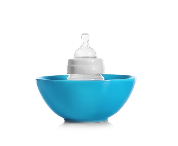 Baby bottle in bowl, — Stock Photo, Image