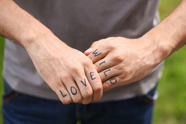 Fists with fake tattoo — Stock Photo, Image