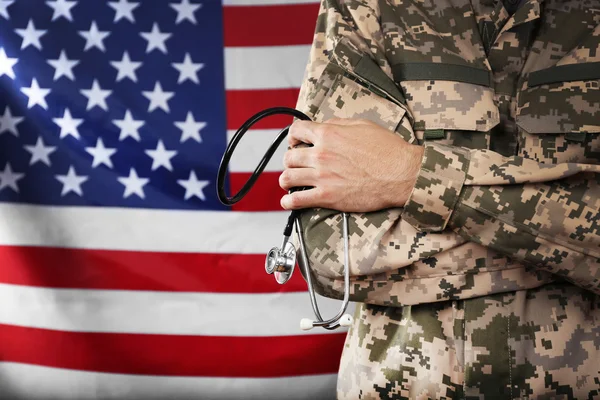 Army doctor holding stethoscope — Stock Photo, Image