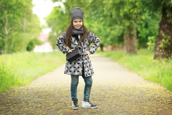 Little girl wearing stylish clothes outdoors. — Stock Photo, Image
