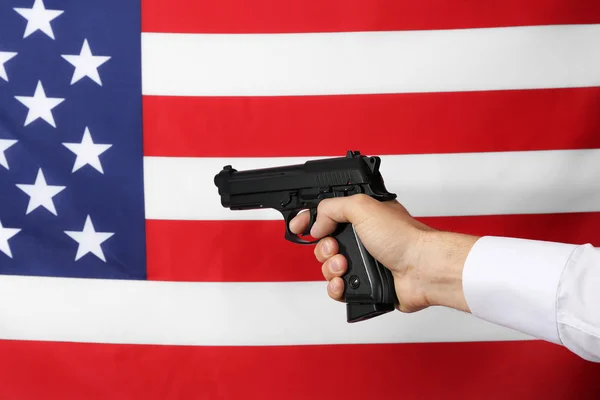 Man's hand holding gun — Stock Photo, Image