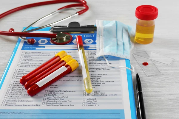 Blood samples and stethoscope — Stock Photo, Image