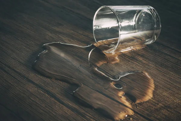 Glass of water spilled — Stock Photo, Image