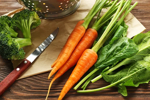 Carrots with herbs on table — Stock Photo, Image