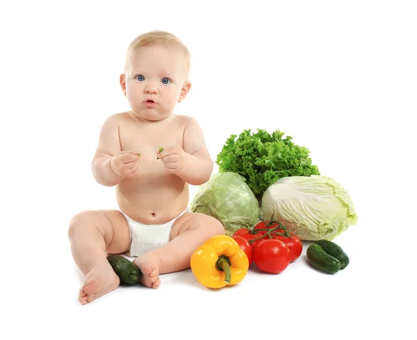 Cute baby and fresh vegetables — Stock Photo, Image