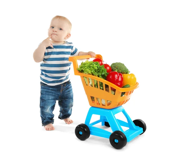 Söt baby med shopping vagn — Stockfoto
