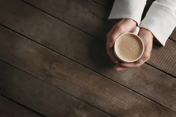 Man holding in hands cup of coffee
