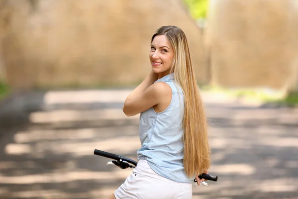 Beautiful girl riding bike — Stock Photo, Image