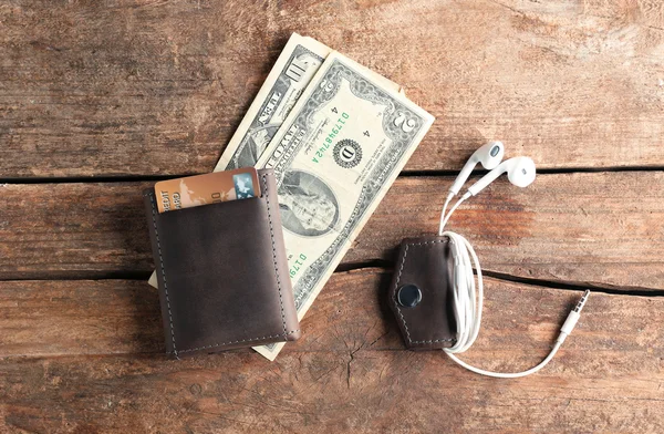 Leather wallet with money and accessories — Stock Photo, Image