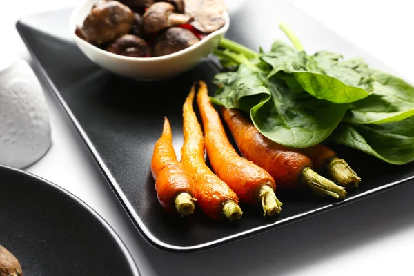 Tasty dish with baby carrots — Stock Photo, Image