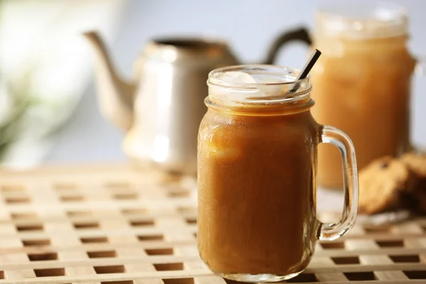 Iced coffee in glass jar — Stock Photo, Image