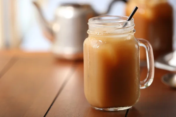 Iced coffee in glass jar — Stock Photo, Image