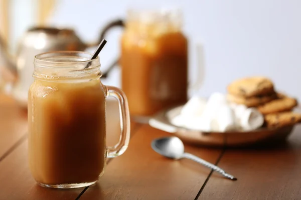 Iced coffee in glass jar — Stock Photo, Image