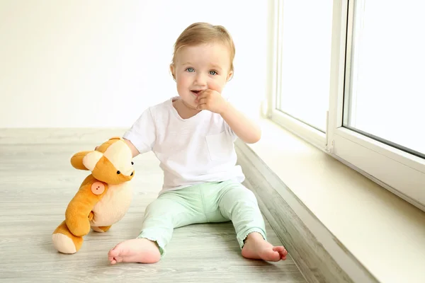 Baby sitting with teddy bear — Stock Photo, Image