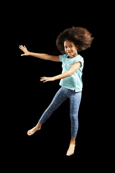 Happy African girl jumping — Stock Photo, Image