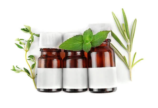 Dropper bottles and herbs — Stock Photo, Image