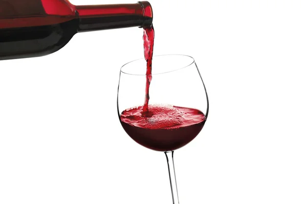 Red wine pouring in glass, — Stock Photo, Image