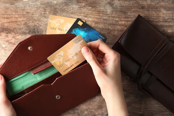 Woman taking credit card — Stock Photo, Image