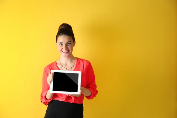 Cute young woman holding tablet — Stock Photo, Image