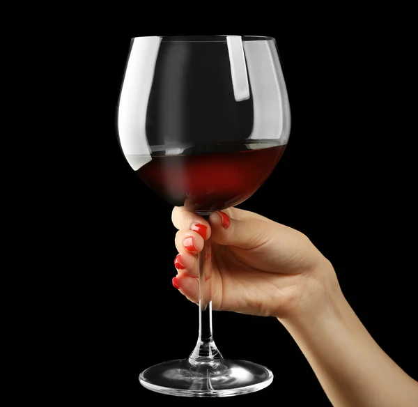 Female hand holding glass of wine — Stock Photo, Image