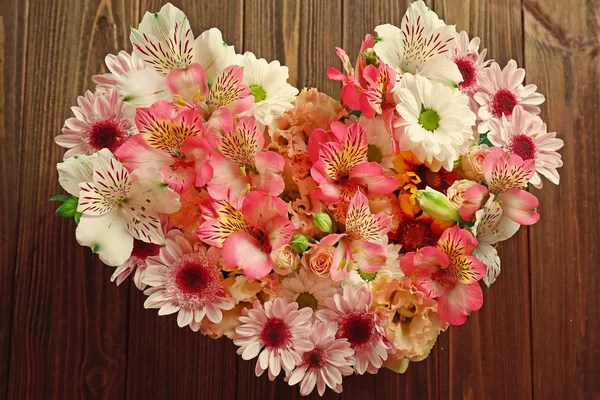 Beautiful flowers in a heart shape — Stock Photo, Image