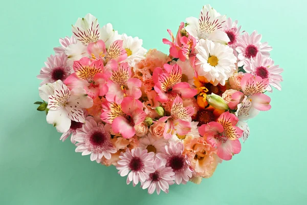 Beautiful flowers in a heart shape — Stock Photo, Image