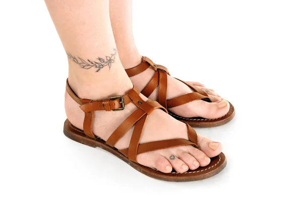 Female feet with tattoo — Stock Photo, Image