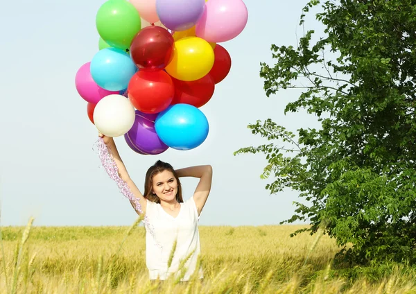 Mujer con globos de colores — Foto de Stock