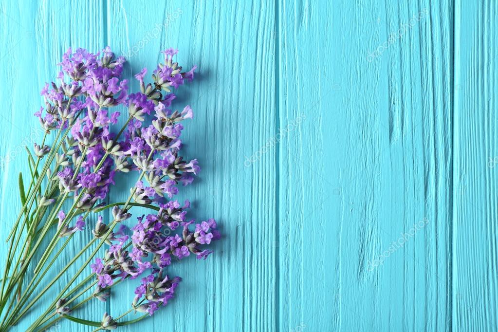 Lavender flowers on wooden background Stock Photo by ©belchonock 118121904