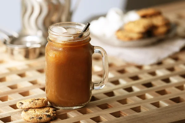 Iced coffee in glass jar — Stock Photo, Image