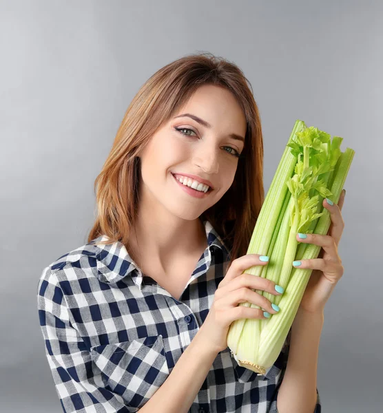 Beautiful girl with celery — Stock Photo, Image