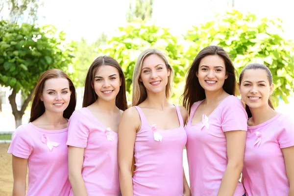 young women in pink shirts