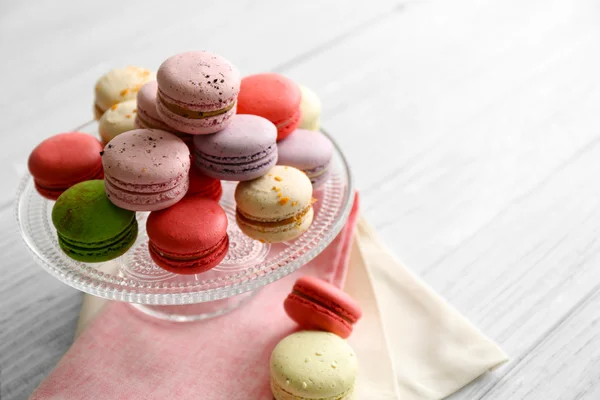 Colorful tasty macaroons in glass stand — Stock Photo, Image