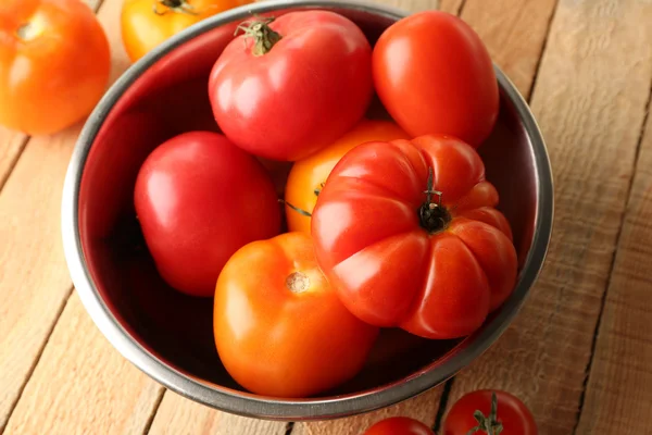Different tomatoes in metallic bowl — Stock Photo, Image