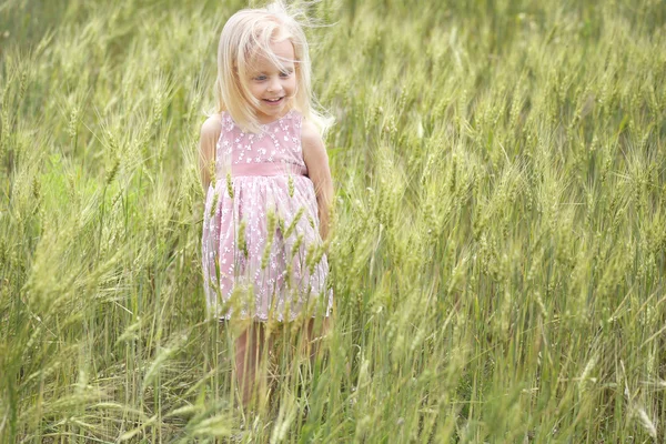 Little girl with bouquet — Stock Photo, Image