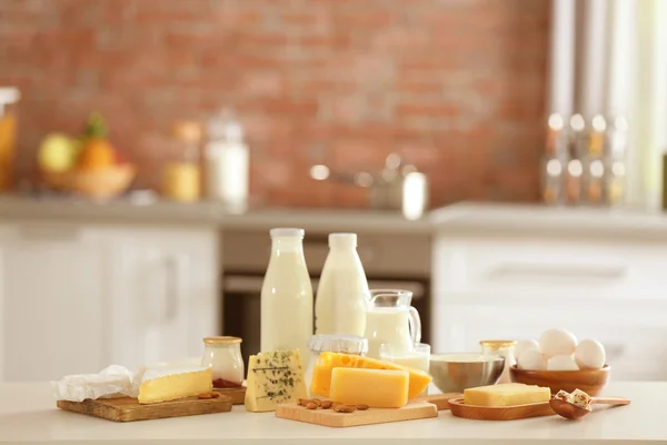 Dairy products on kitchen table — Stock Photo, Image