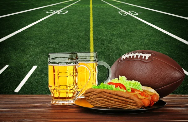 Two glass of beer, ball and snack — Stock Photo, Image