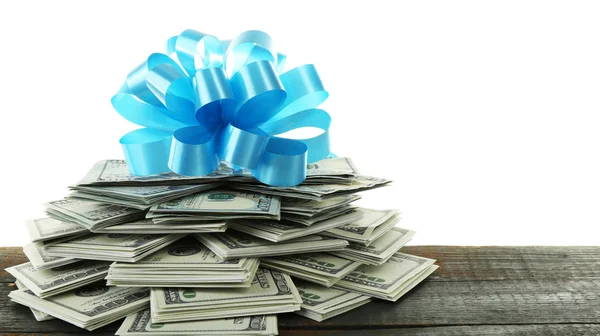 Stapel dollars met boog als geschenk — Stockfoto