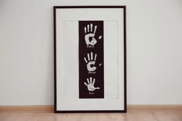 Family hand prints in frame — Stock Photo, Image