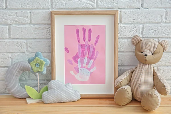 Family hand prints in frame — Stock Photo, Image
