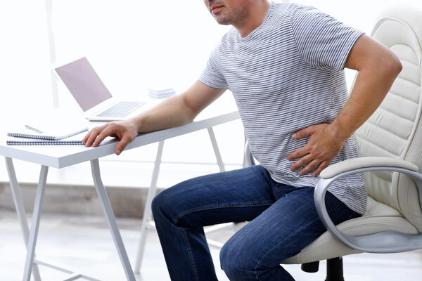 Man suffering from back pain