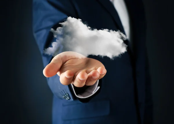 Бизнесмен держит облако Лицензионные Стоковые Изображения