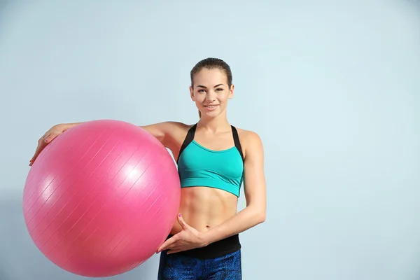 Girl with ball on blue — Stock Photo, Image