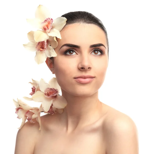 Pretty woman with orchid — Stock Photo, Image